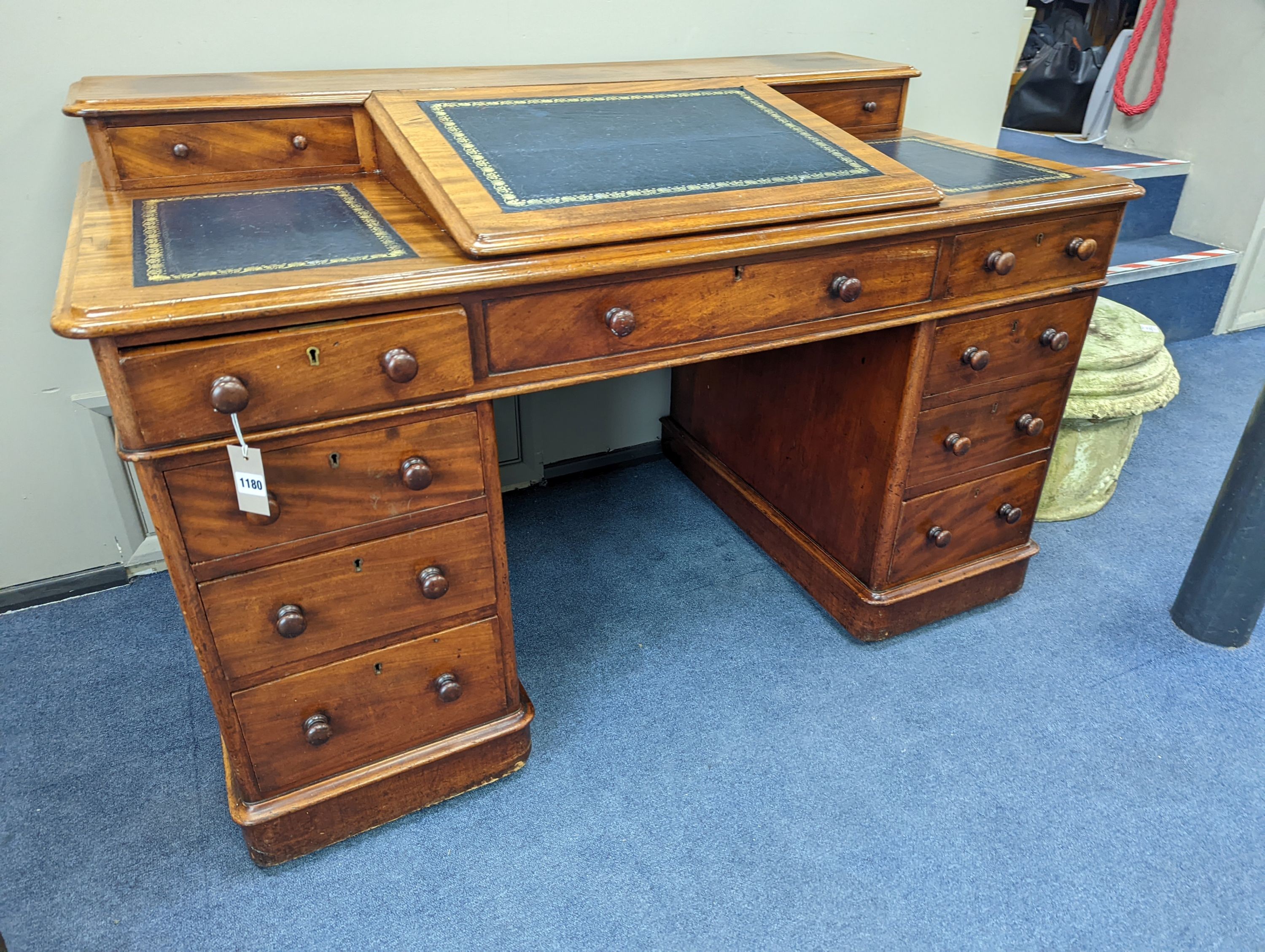 A Victorian ‘Dickens’ mahogany pedestal desk, width 137cm, height 87cm